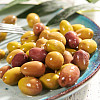 Savourez les meilleures olives Taggiasca de Ligurie. Cette variété a une peau tachetée de noir et de violet ou de vert, et une chair intensément épicée dont le goût est renforcé par le jus herbacé.